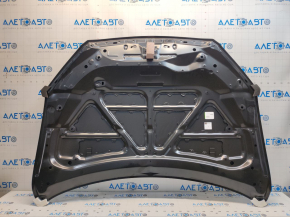 The hood of a Mazda CX-5 13-16 is bare steel, with dents and a bump.