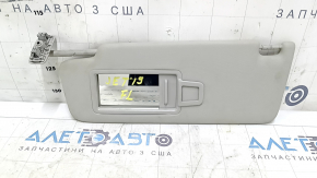 Left sun visor for a VW Jetta 19-24, gray, no hook, no light, dents, needs cleaning