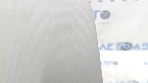 Left sun visor for a VW Jetta 19-24, gray, no hook, no light, dents, needs cleaning