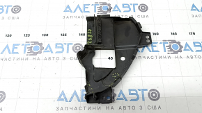 The left radiator grill bracket for Mazda CX-30 20-23 is dented and cracked.