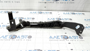The front right headlight bracket for a Mazda CX-30 20-23 is broken.