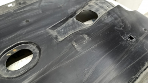 Front left underbody protection for Mazda CX-30 20-23 is worn and dented.