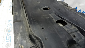 Front left underbody protection for Mazda CX-30 20-23 is worn and dented.