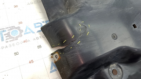 The front right underbody protection of the Mazda CX-30 20-23 is worn and cracked.