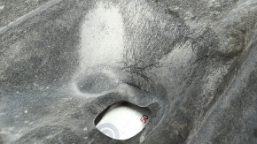 The rear right underbody protection of the Mazda CX-30 20-23 is dented.