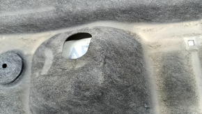 The rear right underbody protection of the Mazda CX-30 20-23 is dented.