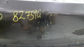 The rear bumper is bare, Toyota Camry v40 07-11 3.5 graphite 1G3, dented, with tears, broken fasteners, and scratches.