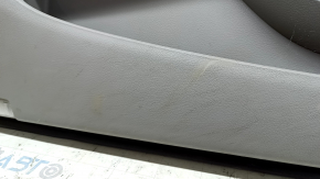 The front left door panel of a Toyota Camry v40 is gray, the armrest is gray leather, the insert is wood, with a handle, no controls, the plastic has turned white, needs cleaning, the leather has peel