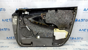 The front left door panel of a Toyota Camry v40 is gray, the armrest is gray leather, the insert is wood, with a handle, no controls, the plastic has turned white, needs cleaning, the leather has peel