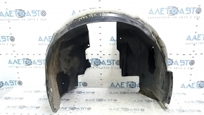 The front right fender liner of a Ford Fusion mk5 17-20 is torn.