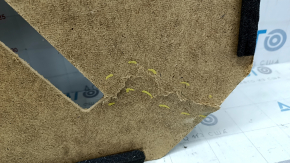The trunk floor of the Toyota Camry V40 is torn and dented.