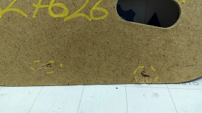 The right trunk floor of a Toyota Camry V40 has a dent.