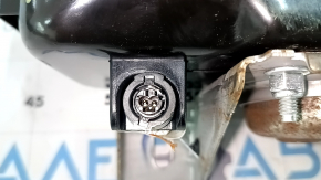 The passenger airbag in the dashboard of a Ford Fusion mk5 17-20 has a rusty squib.