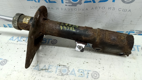 The rear left shock absorber of a Toyota Camry v40 XLE is rusty.