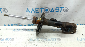 The front right shock absorber for a Toyota Camry v40 3.5 is rusty.