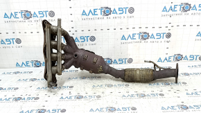 The exhaust manifold with a catalytic converter on a Ford Fusion mk5 17-20 hybrid is rusty and the mesh is torn.