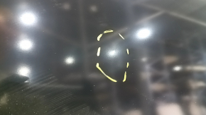 The front left door of a Mazda CX-9, 16-23, has a dent and a bump.