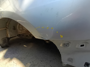 Rear left quarter wing of a Ford Fusion mk5 13-20 on the body, silver, dented, dents, putty
