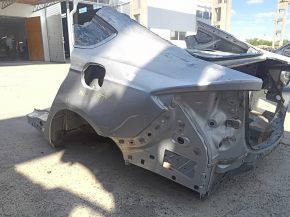 Rear left quarter wing of a Ford Fusion mk5 13-20 on the body, silver, dented, dents, putty