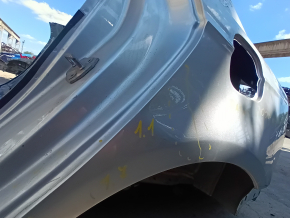 Rear left quarter wing of a Ford Fusion mk5 13-20 on the body, silver, dented, dents, putty