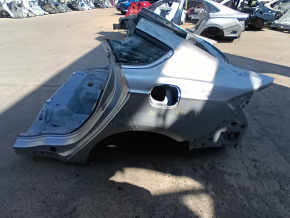 Rear left quarter wing of a Ford Fusion mk5 13-20 on the body, silver, dented, dents, putty