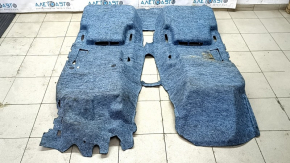 The floor covering of the VW Jetta 19-24 is black, torn, needs cleaning.