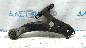 The lower front right control arm of a Toyota Camry v40 is rusty and the silent block is torn.