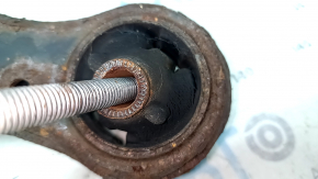 The lower front right control arm of a Toyota Camry v40 is rusty and the silent block is torn.