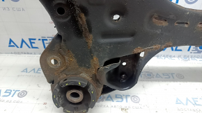 The front subframe of a Toyota Camry v40 is rusty, with four cracked bushings.