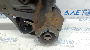 The front subframe of a Toyota Camry v40 is rusty, with four cracked bushings.