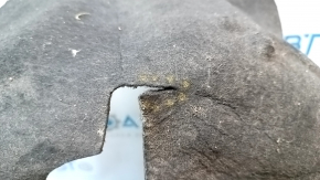The rear right fender liner of a Chrysler 200 15-17 is torn.