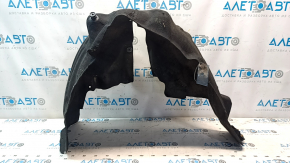 The rear right fender liner of a Chrysler 200 15-17 is torn.