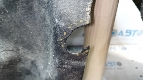 The rear left fender liner of a Chrysler 200 15-17 is torn.