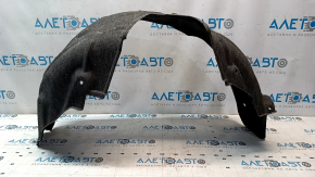 The rear right fender liner of a Toyota Camry v55 15-17 USA is torn.