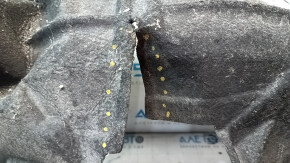 The rear left fender liner of a Chevrolet Volt 16 is torn and the seam has come apart.