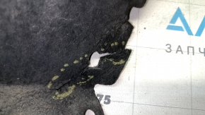 The rear left fender liner of a Chevrolet Volt 16 is torn and the seam has come apart.