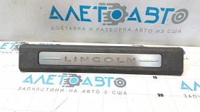 Lincoln MKX 16-18 front right door sill plate, brown with chrome and backlight, worn