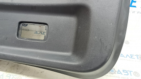 Mazda CX-9 16-23 black lower tailgate trim with handle, scratches, dents, broken cap mount, scuffed, broken mount, cracks in guides