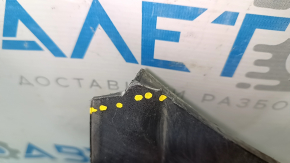 The plastic windshield wiper grille for a Chevrolet Volt 11-15 has broken corners.