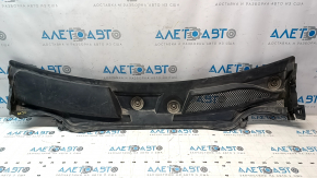 The plastic windshield wiper grille for an Infiniti QX30 2017-2019 is cracked and missing a fastener.