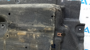 The left underbody protection of the Mazda CX-9 16-23 is dented and scuffed.