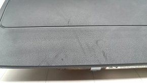 The driver's left knee airbag for the Audi E-Tron 19-23 has scuffs and a rusty squib.
