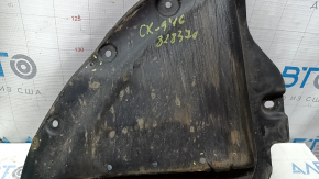 Right front mudguard liner for Mazda CX-9 16-23 is worn, has non-factory holes, and is torn.