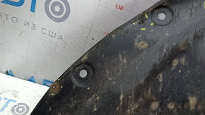 Right front mudguard liner for Mazda CX-9 16-23 is worn, has non-factory holes, and is torn.