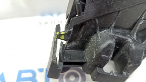 The left rear bumper mount on the Audi E-Tron 19-23 fender is broken and cracked.