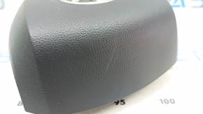 Black, worn steering wheel airbag for the driver's side of a Toyota Sienna 21-24.