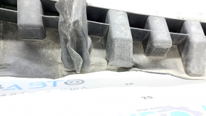 The lower front bumper absorber of a Toyota Sienna 21-24 is dented and the mount is broken.
