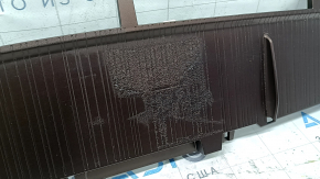 The lower front panel trim of a Toyota Sienna 21-24 is brown and the coating is swollen.