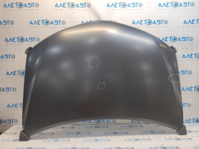 The hood of a Toyota Camry V50 12-14 USA is bare steel, with dents and a fold.