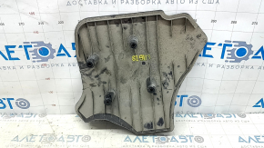 The rear right control arm cover under the spring of the BMW 3 G20 19-24 is worn and dented.